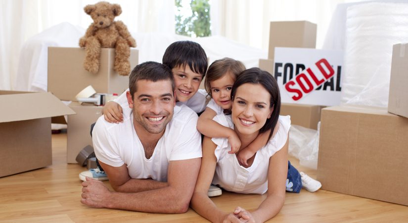 Happy family lying on floor after buying new house topics to address with realtor