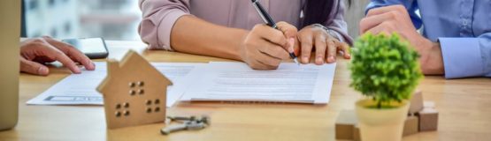 a realtor signing a contract protect yourself from real estate scams